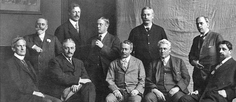 This photo of "The Ten" shows the members who had gathered in Washington D.C. on New Year's Day, 1908. Back in 1897, Hassam joined these notable artists who left their association with other American Impressionists to form a new limited society known as "The Ten."  Seated, left to right: Edward Simmons, Willard L. Metcalf, Childe Hassam, J. Alden Weir, Robert Reid. Standing left to right: William Merritt Chase, Frank W. Benson, Edmund C. Tarbell, Thomas Wilmer Dewing, and Joseph DeCamp