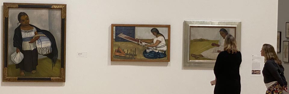 Visitors to SFMOMA's Diego Rivera's America, viewing his Girl in Blue and White, Weaving and Winding Thread