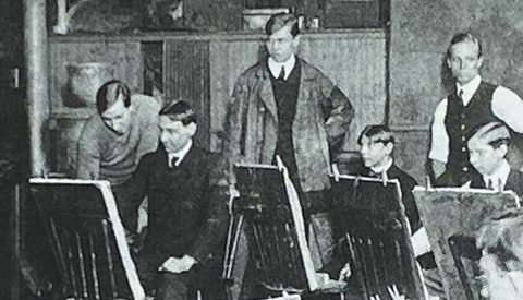 Robert Henri's drawing class closeup, 1905 Edward Hopper is the tall artist in the center.  To his right is Rockwell Kent,  to his left leaning over the easel is George Bellows.