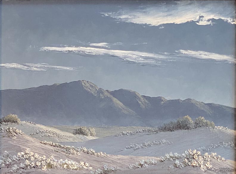 John W Hilton, Moonlight in the Desert, White blooming vervena on moonlit dunes with blue mountains in the distance and white clouds above