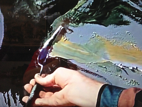 Joshua Meador's hand applying paint to a canvas in Walt Disney's 4 Artists Paint 1 Tree
