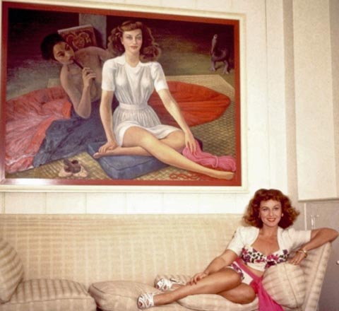 Paulette Goddard, reclined on her couch below her portrait by Diego Rivera