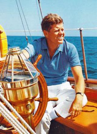 John F Kennedy at the helm of his sailboat