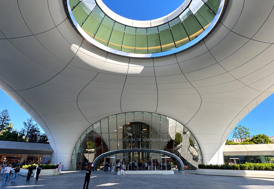 The entrance of the Lucas Museum of Narrative Art with its architectural oculus above.