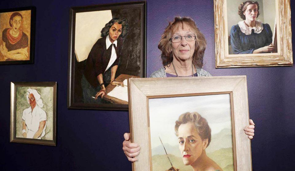 Maureen St. Gaudens holding a self portrait of Ruth Miller Kempster
