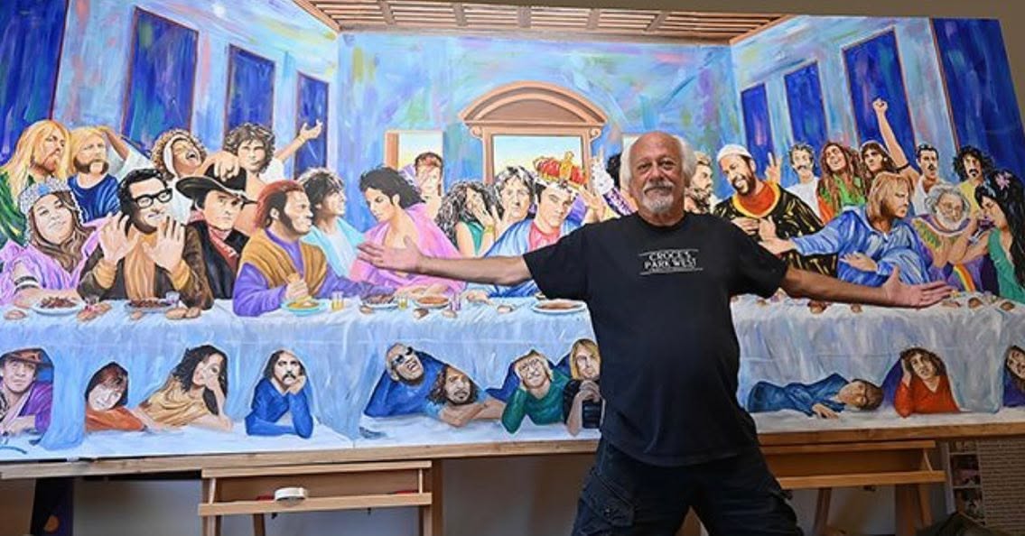 Artist Ruby Mazur with a his career capping painting, The Rock n Roll Last Supper a parody of Leonardo Da Vinci's painting, featuring the many rock stars Mazur painted over his marvelous career.